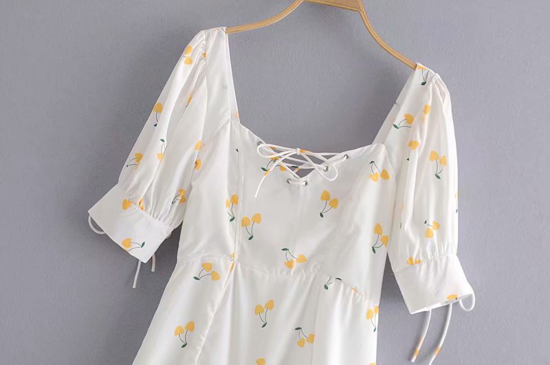 White and yellow vintage summer mini dress with puff sleeves, high waist, and silk-like fabric by The Clothing Company Sydney