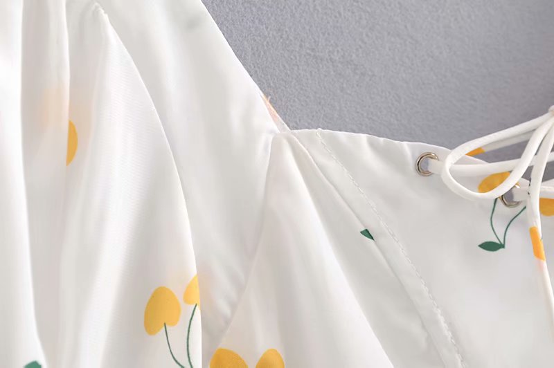 Elegant vintage summer white and yellow cherry print dress with puff sleeves, high waist, and silk-like fabric from The Clothing Company Sydney