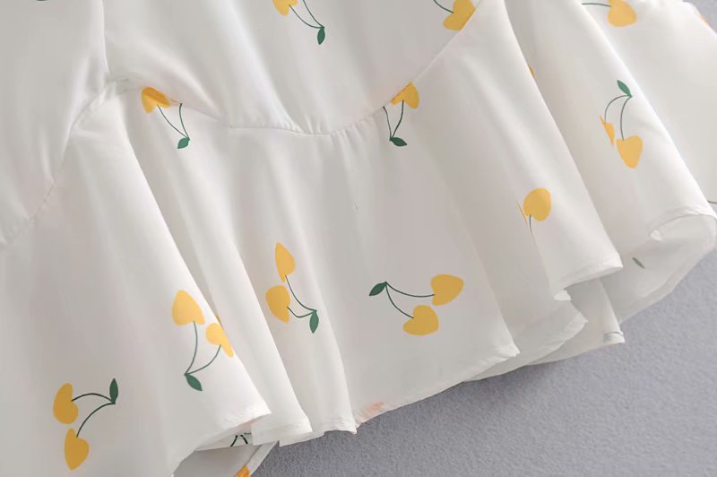Elegant vintage white and yellow cherry print summer dress with puff sleeves, high waist, and silk-like fabric by The Clothing Company Sydney