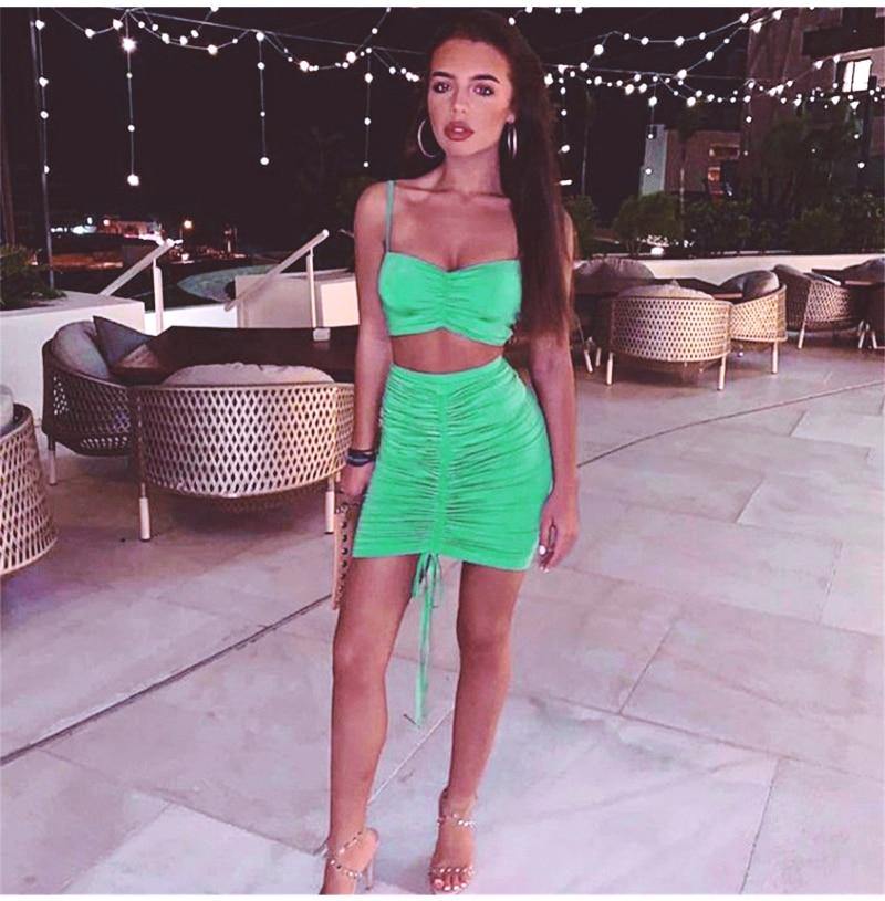 Green summer two-piece set for women featuring a ruched crop top and matching skirt, from The Clothing Company Sydney.