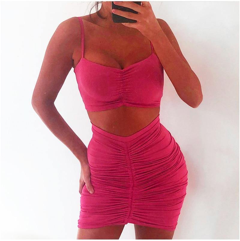Green women's summer two-piece set with ruched crop top and matching skirt, from The Clothing Company Sydney.