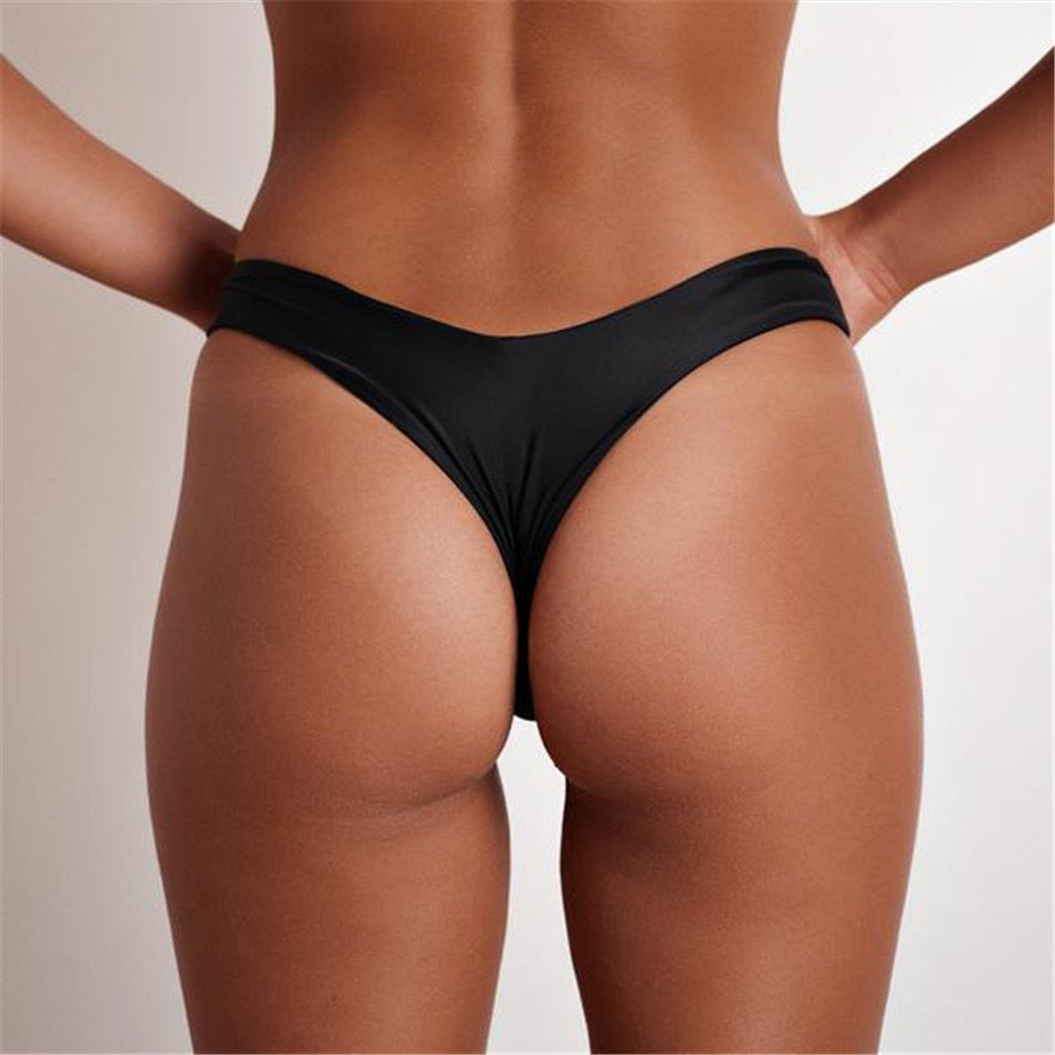 Brazilian women's thong bikini bottoms in solid color, low waist swim trunks from The Clothing Company Sydney, cheeky and stylish.