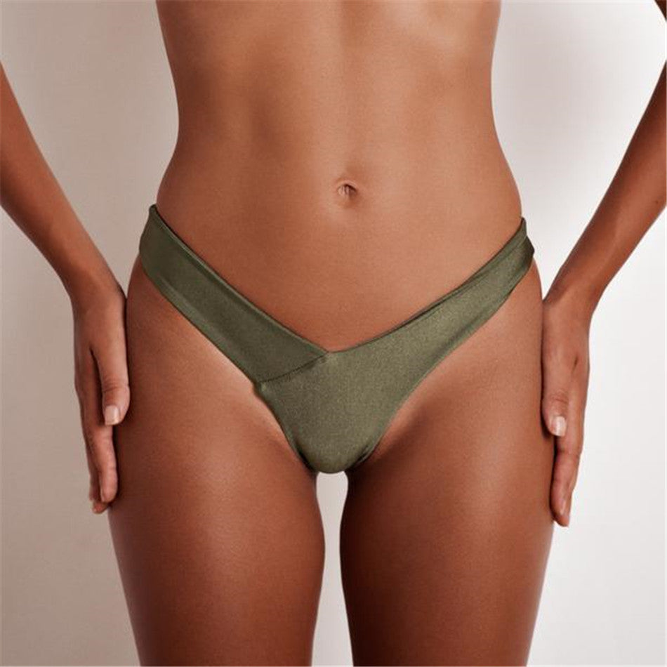 Brazilian women’s thong bikini bottoms with low waist fit, solid color, cheeky cut, from The Clothing Company Sydney.