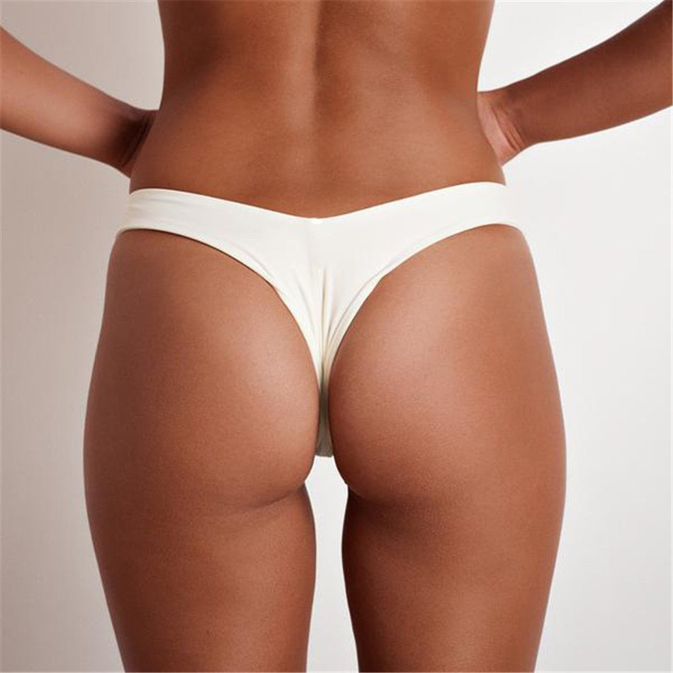 Brazilian women's thong swimsuit briefs by The Clothing Company Sydney, low waist, solid color, cheeky bikini bottom for swimming.
