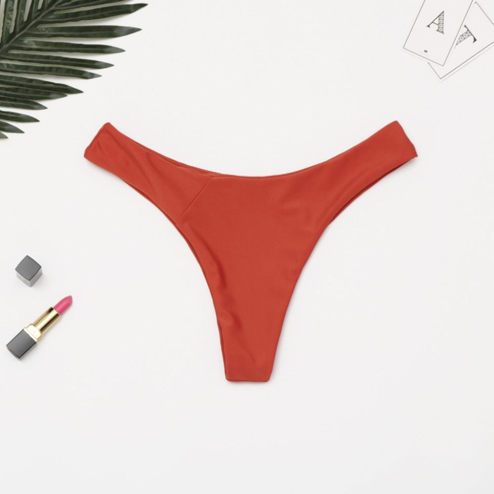 Brazilian women's thong bikini bottom by The Clothing Company Sydney, low waist solid swimwear with cheeky fit.