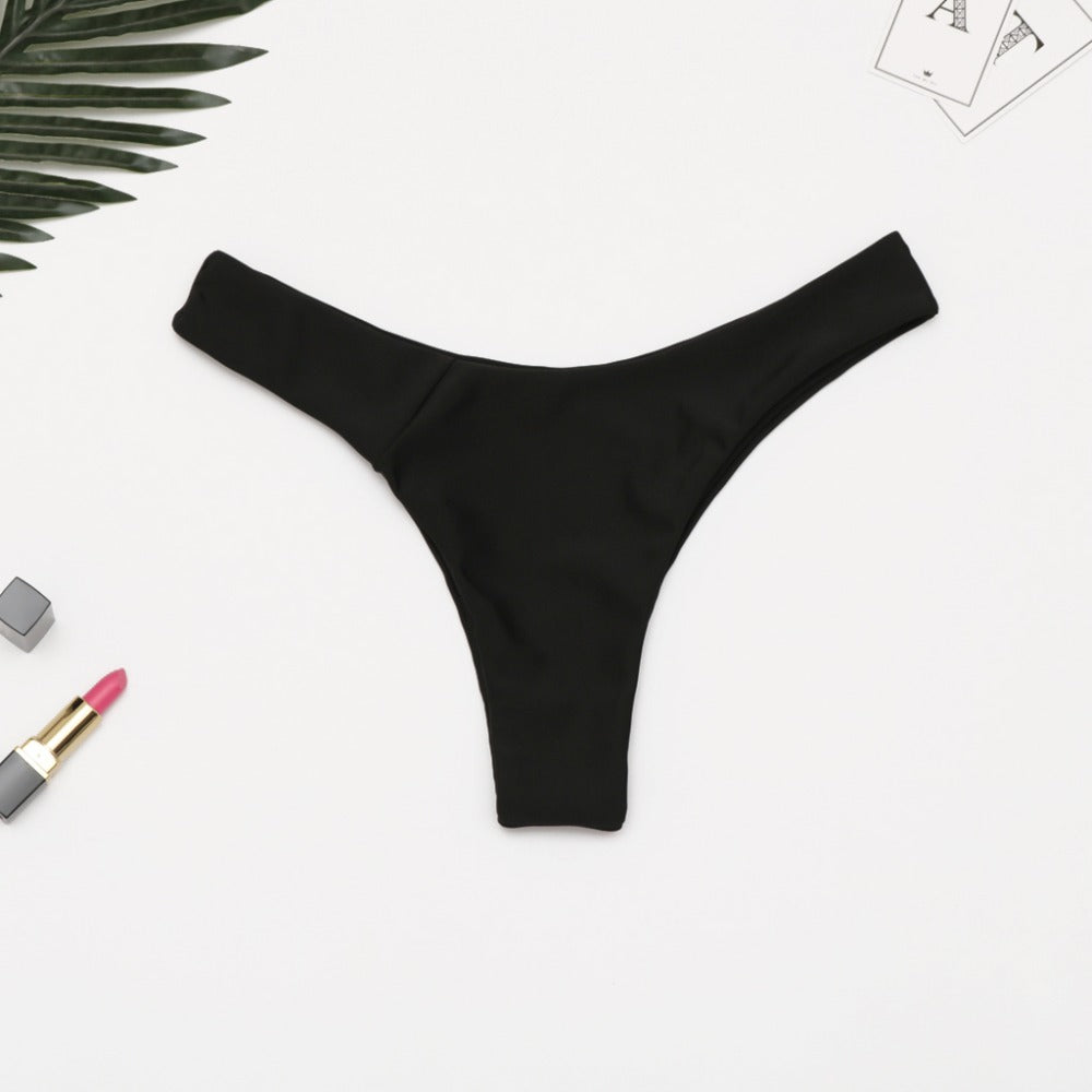 Brazilian women's thong bikini bottom by The Clothing Company Sydney, low waist solid swimwear with cheeky coverage.