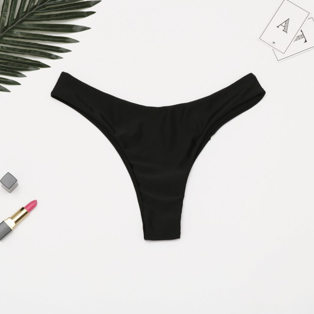 Brazilian women's thong bikini bottom by The Clothing Company Sydney, low waist solid swimwear with cheeky coverage.