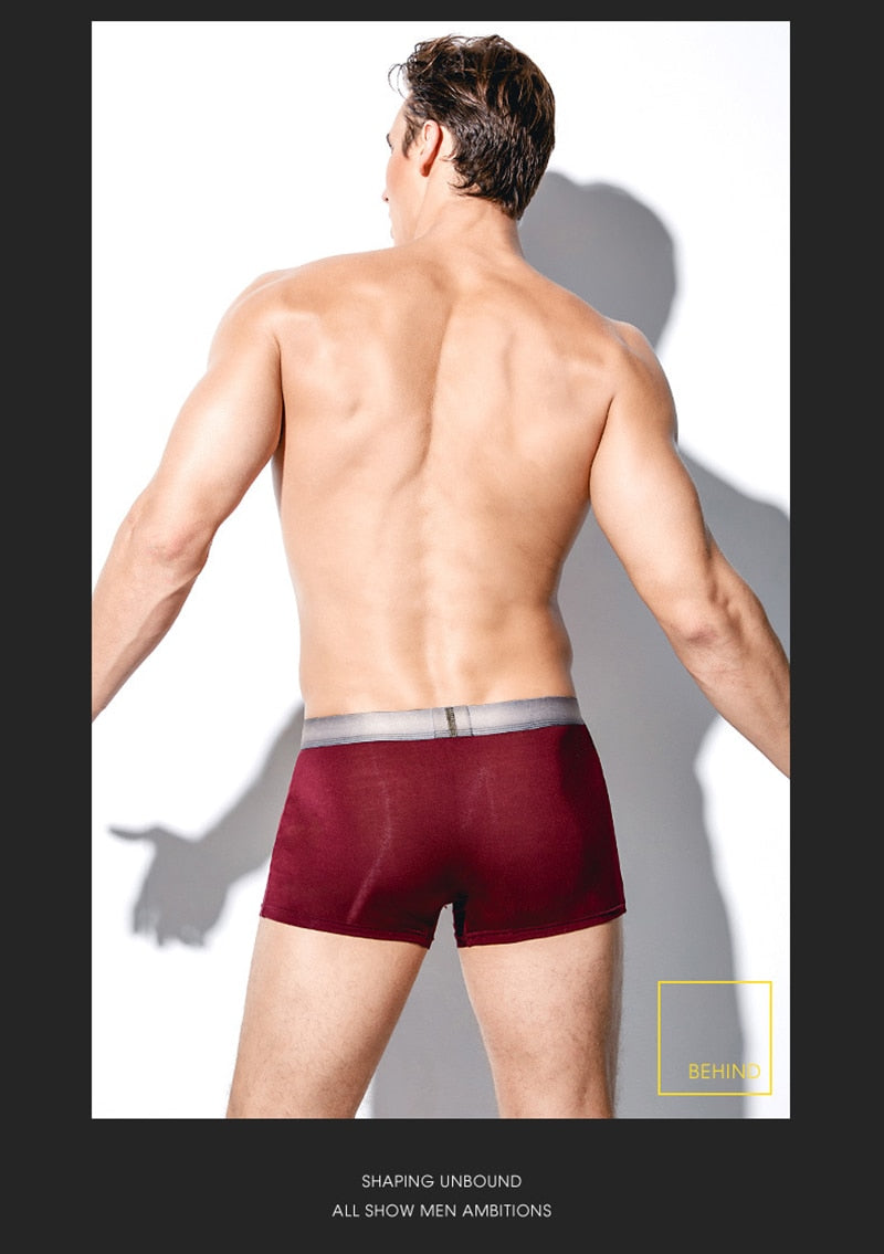Four pairs of breathable men's boxer briefs with U-convex design from The Clothing Company Sydney, featuring printed patterns.