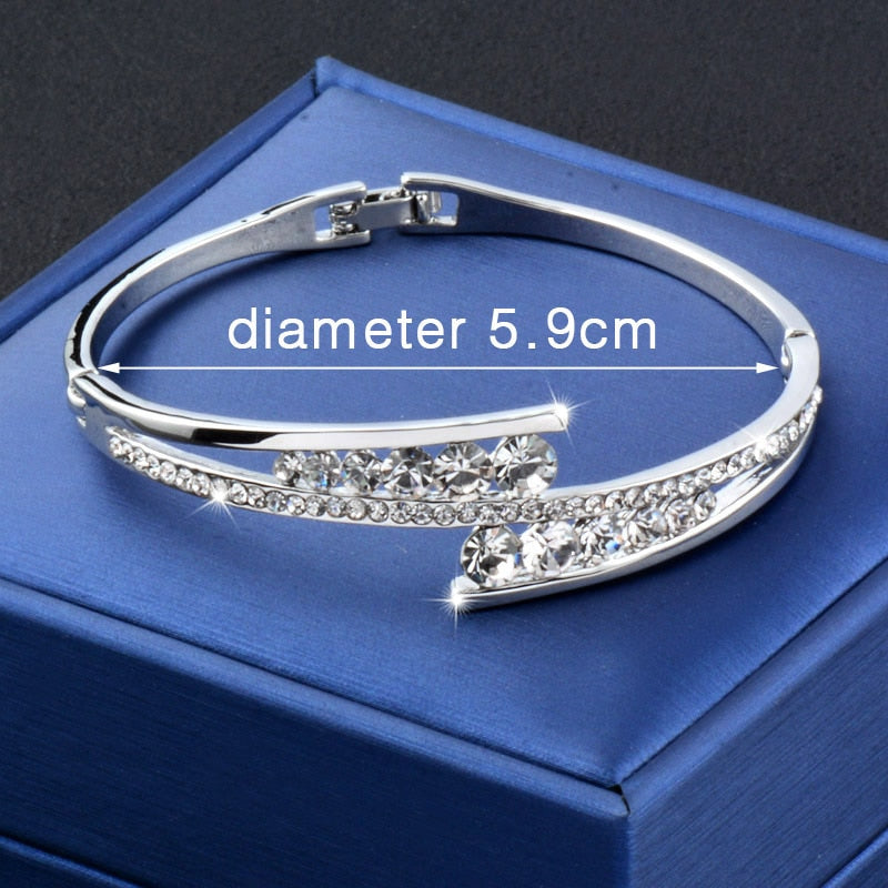 Luxury cubic zirconia hollow bangle bracelet with sparkling crystals, featuring an elegant cuff design by The Clothing Company Sydney.