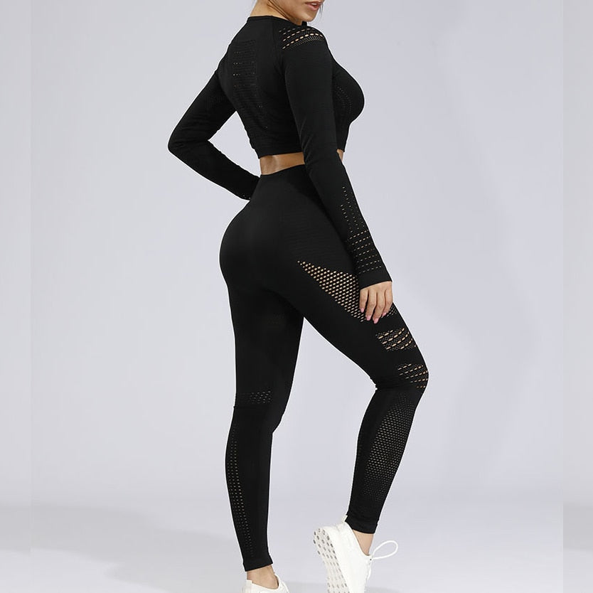 Fitness set by The Clothing Company Sydney featuring long athletic leggings and seamless hollow-out long sleeve sports top.