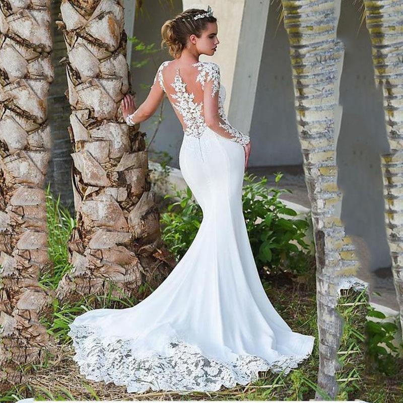 Vintage mermaid wedding dress with scoop neck, full sleeves, lace details, satin fabric, zipper back from The Clothing Company Sydney.