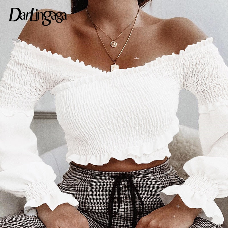 White smocking off-shoulder blouse for women with long sleeves and criss-cross design, from The Clothing Company Sydney.