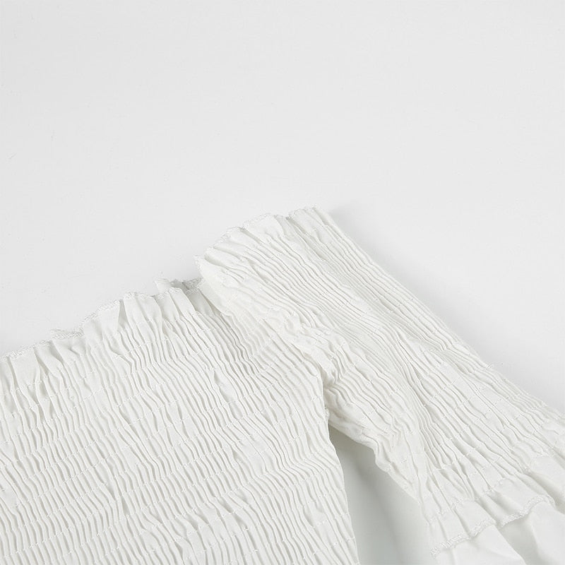 White long sleeve smocking off-shoulder blouse for women with criss-cross detail, stylish crop top by The Clothing Company Sydney.