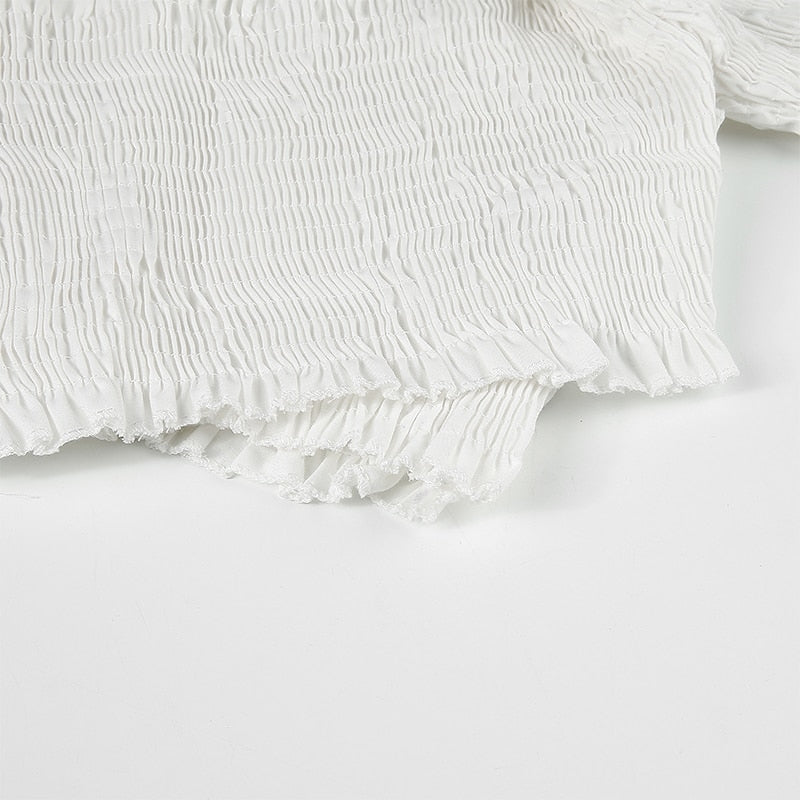 White smocked long sleeve blouse for women with off-shoulder and criss-cross design from The Clothing Company Sydney