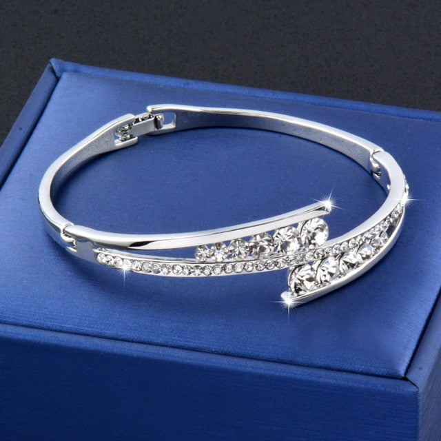 Cubic zirconia hollow bangle cuff bracelet with sparkling crystals, elegant jewelry piece by The Clothing Company Sydney.