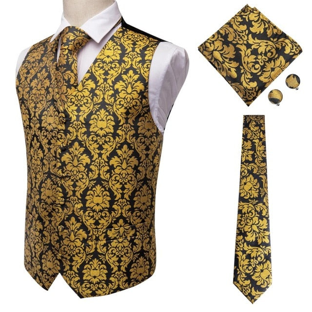 Four-piece men's navy paisley silk vest set with dark blue jacquard dress vest, tie, cufflinks, and pocket square accessories.