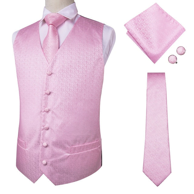 Four-piece men's navy paisley silk dress vest set with pocket square, cufflinks, and tie, featuring dark blue jacquard fabric.