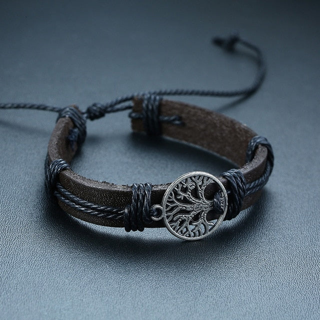 Four-piece men's braided leather bracelets with wood beads, life tree pendant, and tribal charm, vintage style wristbands.