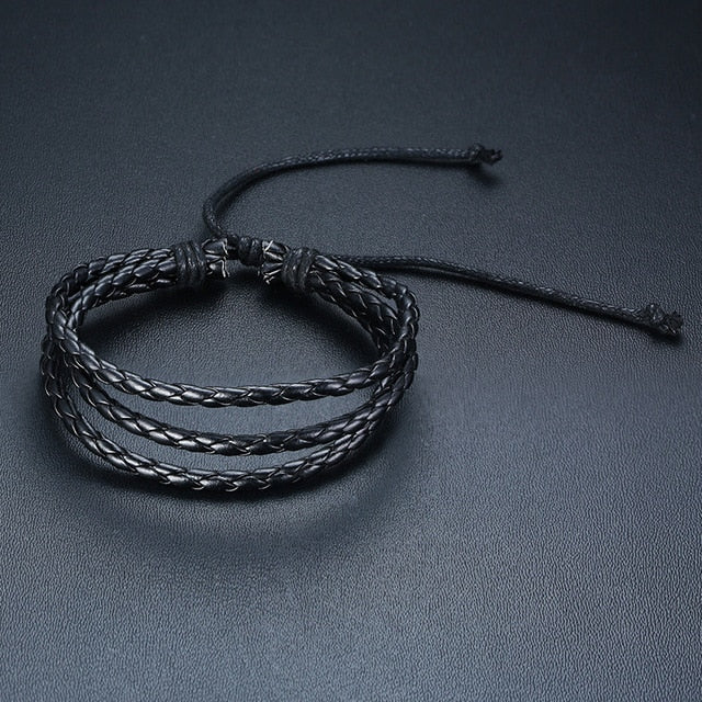 Four braided PU leather bracelets with wood beads, life tree charm, and tribal style design for men.