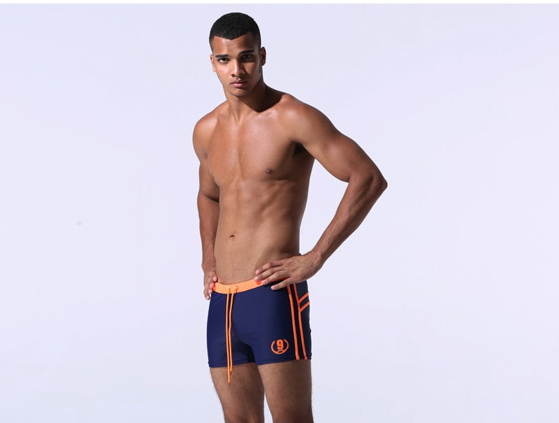 Men's breathable swim trunks by The Clothing Company Sydney, featuring lightweight fabric and classic beachwear style.