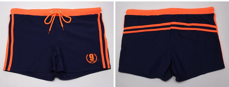Men's breathable swim trunks by The Clothing Company Sydney featuring classic boxer brief style and quick-dry fabric for beach wear.