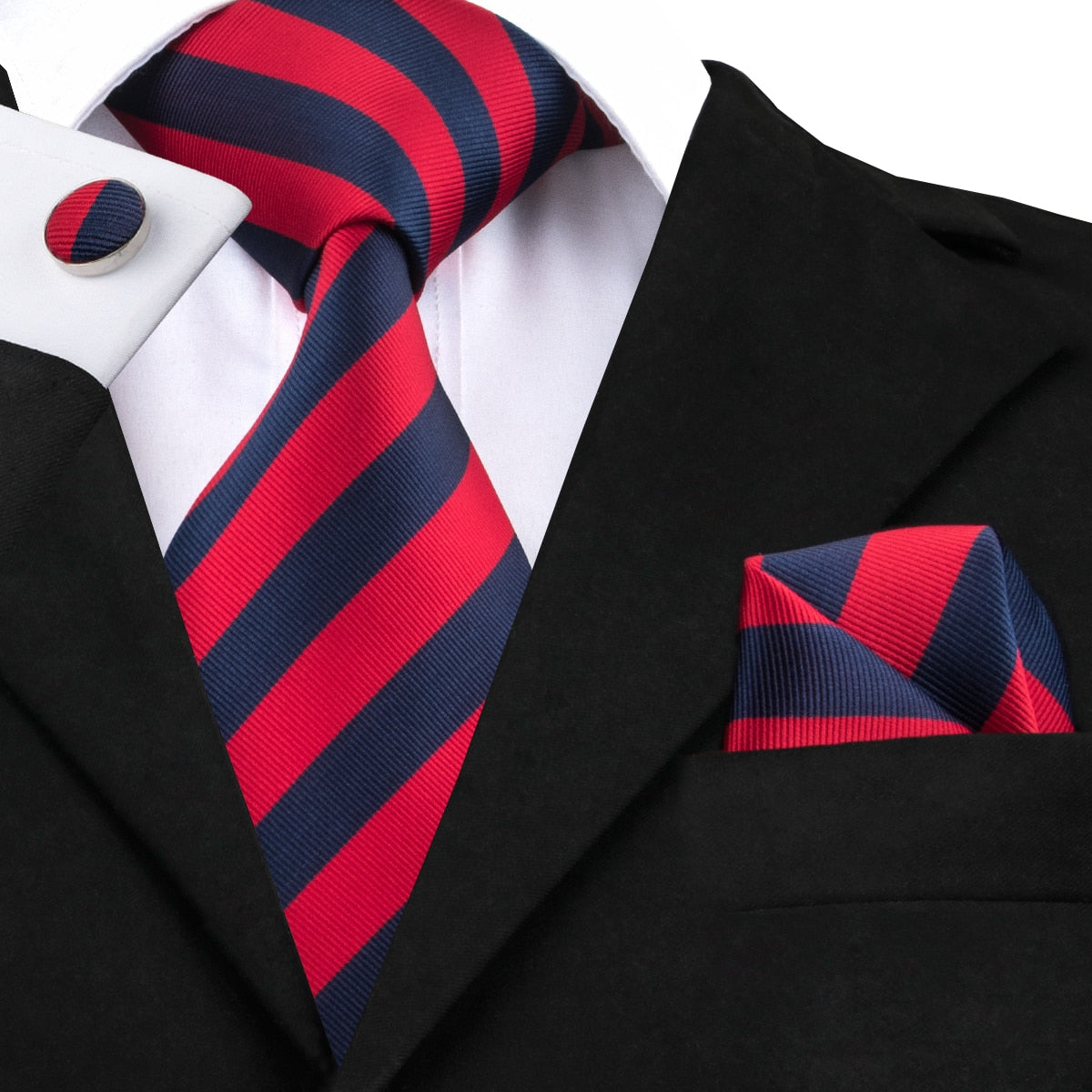 Three-piece men's accessory set with blue and black striped silk tie, pocket square, and cufflinks for wedding or formal events.