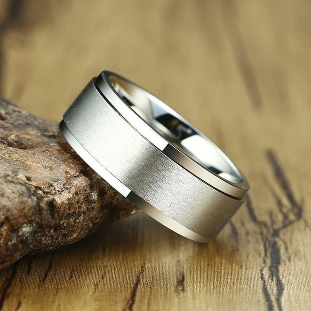 Stainless steel spinner ring for men and ladies, stress relief accessory, casual jewelry, classic wedding band style.