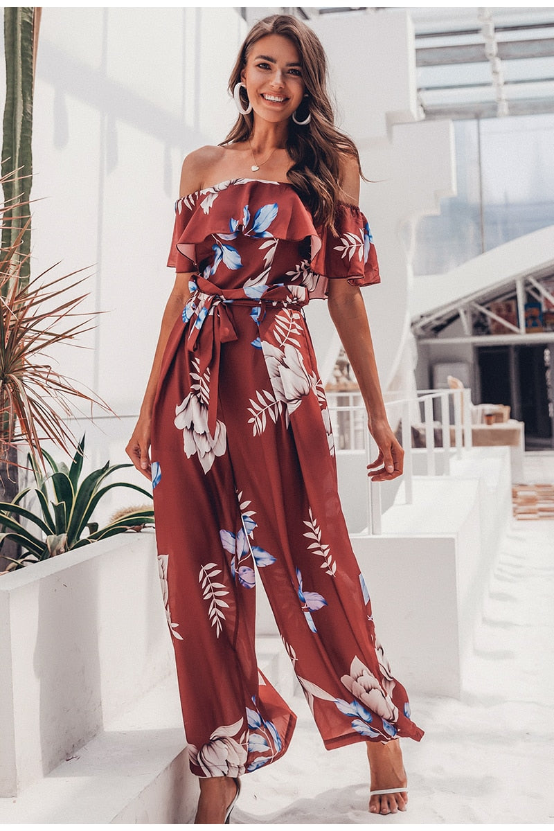 Bohemian floral print off-shoulder summer jumpsuit with ruffled details, long style, perfect for beach and casual wear by The Clothing Company Sydney.