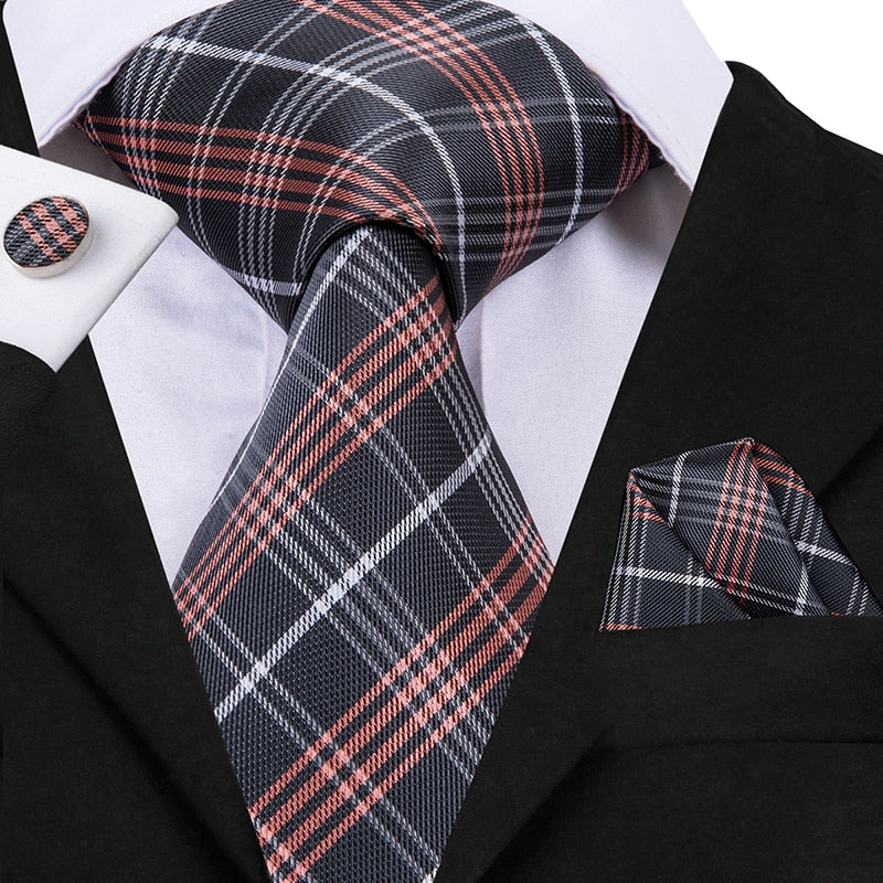 Three-piece men's necktie set including a blue striped silk tie, pocket square, and cufflinks, perfect for business or wedding attire.