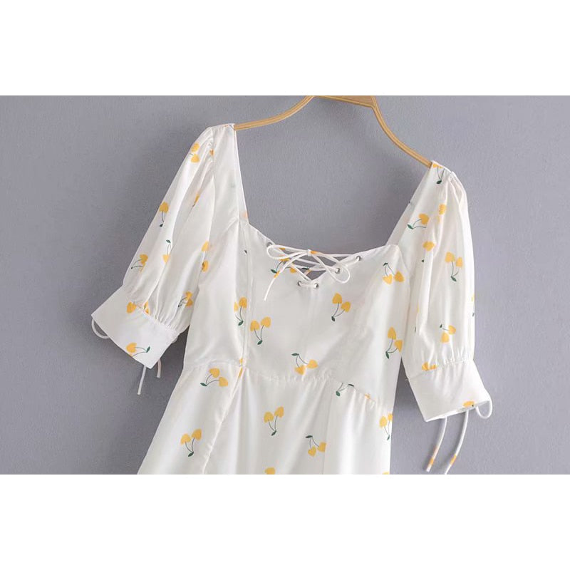 Elegant vintage summer dress by The Clothing Company Sydney with white and yellow cherries, puff sleeves, high waist, silky lining.