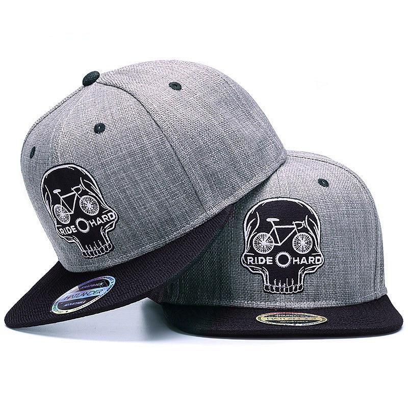 Black baseball snapback hat with embroidered skull design, cool hip hop style cap by The Clothing Company Sydney.