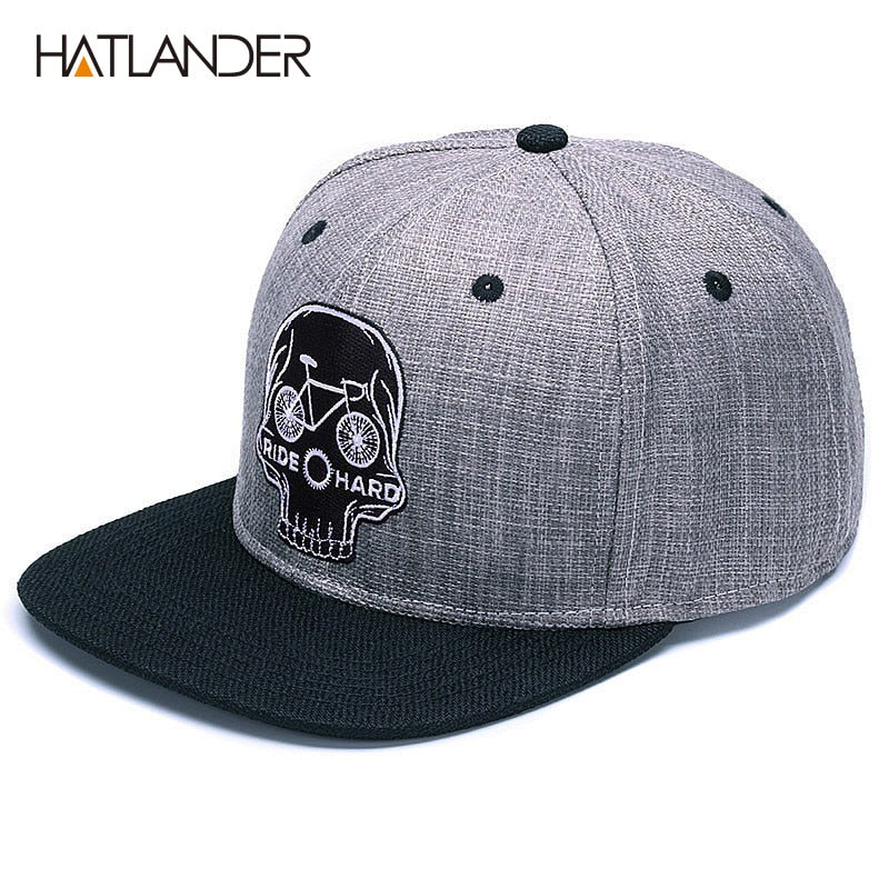 Black baseball snapback hat with embroidered skull design, cool hip hop style cap by The Clothing Company Sydney.