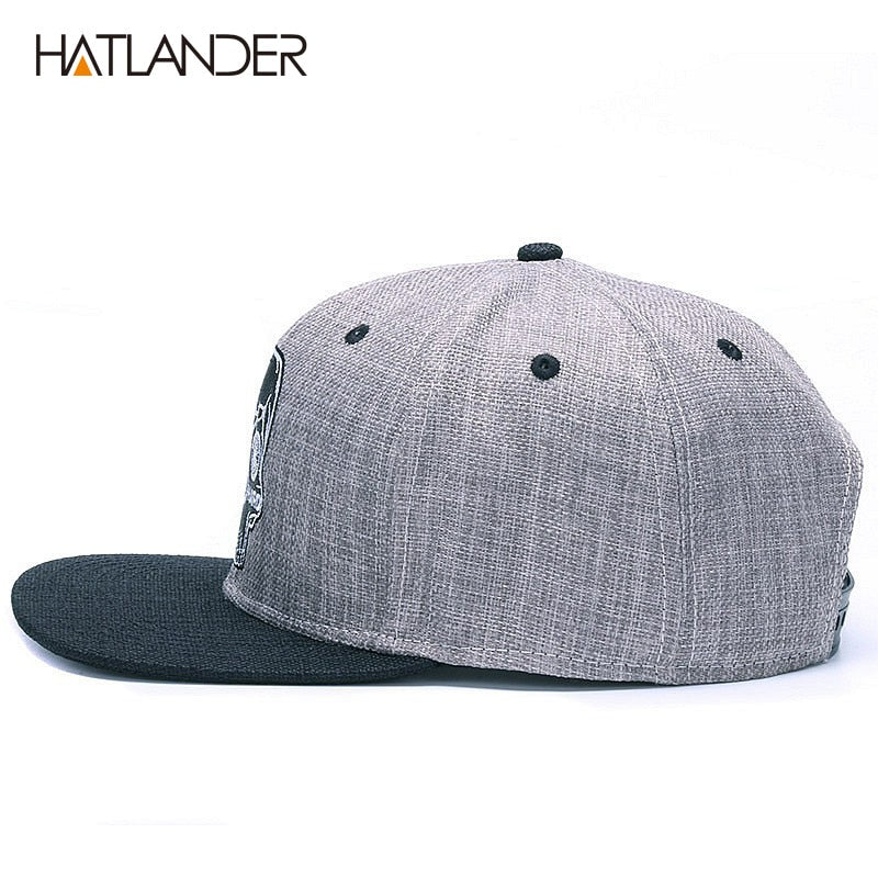 Black baseball snapback hat with embroidered skull design, stylish hip hop cap by The Clothing Company Sydney.
