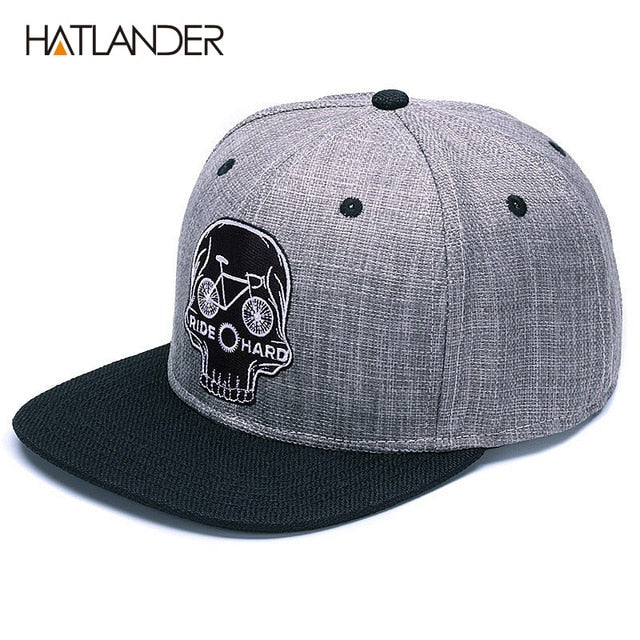 Black baseball snapback hat with embroidered skull design, stylish hip-hop cap by The Clothing Company Sydney.