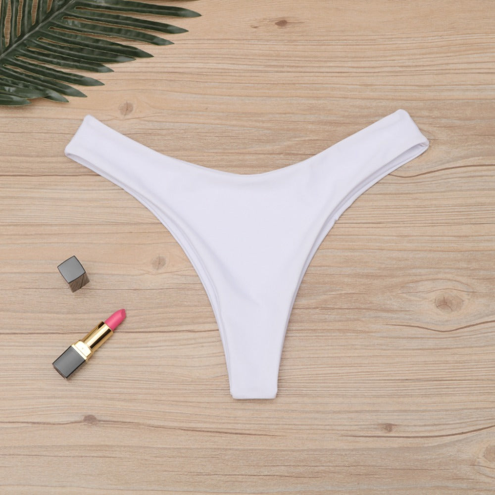 Brazilian women’s thong bikini bottom by The Clothing Company Sydney, low waist, solid color, cheeky swim trunks, swimsuit bottom