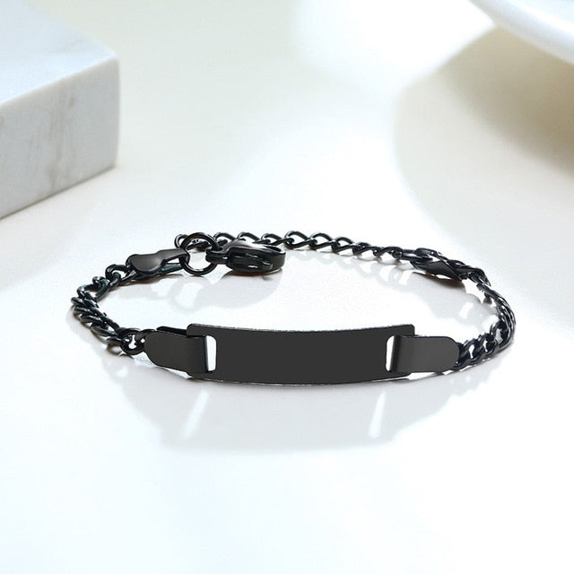 Gold-tone stainless steel adjustable baby name bracelet with personalized engraving, from The Clothing Company Sydney.