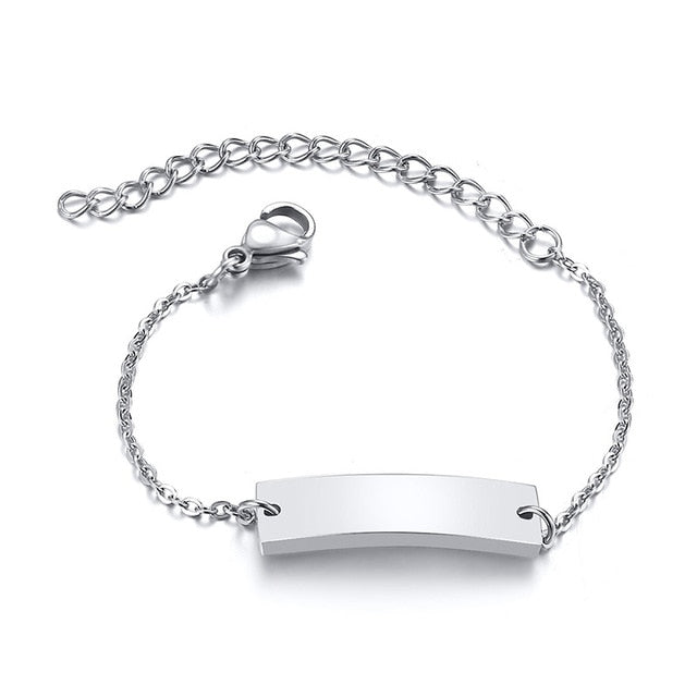 Gold tone personalized baby name bracelet by The Clothing Company Sydney, adjustable stainless steel jewelry with custom name engraving.