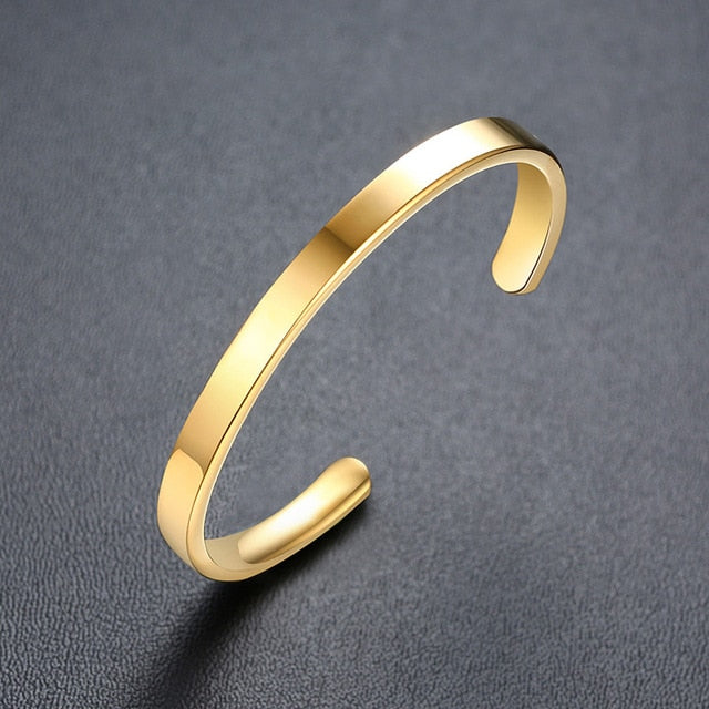 Gold tone stainless steel personalized baby name bracelet with adjustable fit, featuring custom engraved baby name from The Clothing Company Sydney.