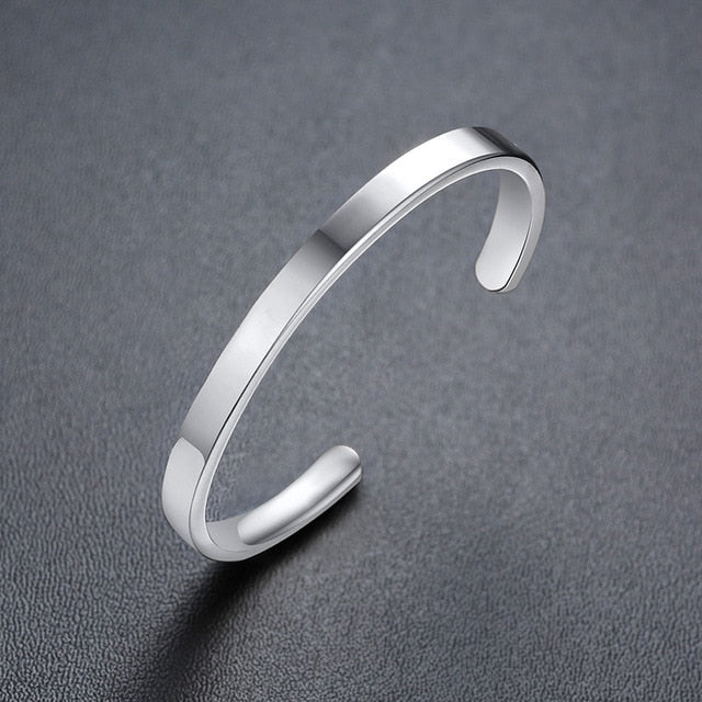 Gold-tone stainless steel personalized baby name bracelet with adjustable fit, crafted by The Clothing Company Sydney.