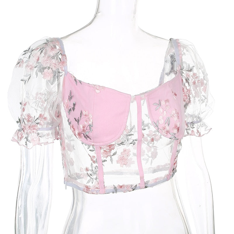Pink mesh cropped bustier top with square neckline, embroidery, puff sleeves, transparent design, perfect for summer fashion.