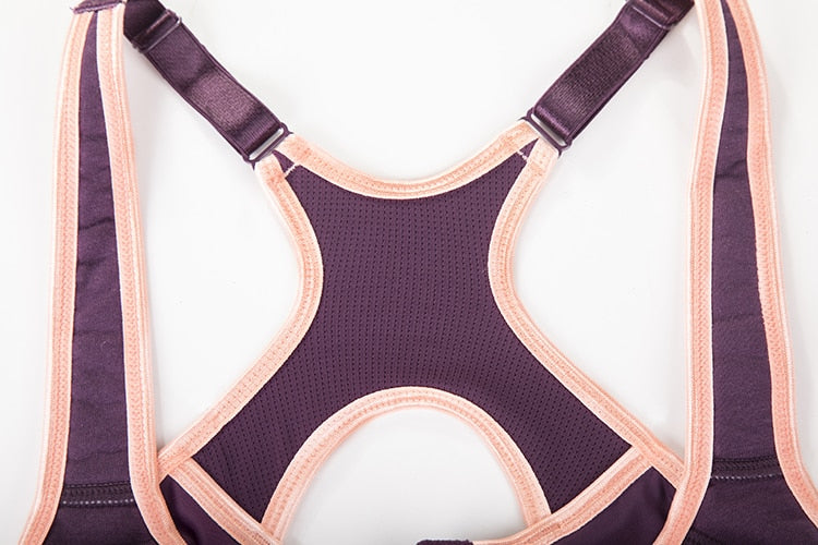 Women's moisture-wicking high-impact sports bra with padded, underwire support and racerback design for full support during workouts.