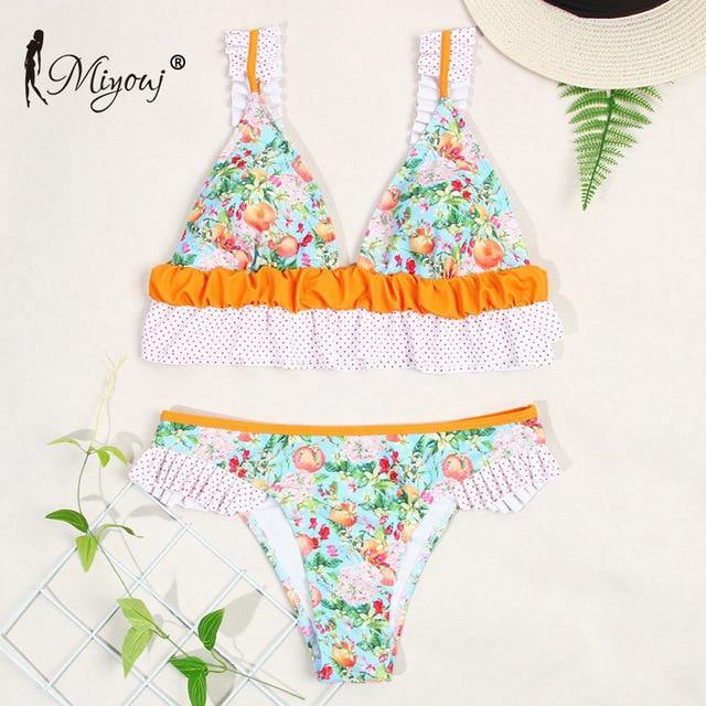 Deep V neck floral print bikini swimsuit with bow and lace-up detail, from The Clothing Company Sydney.