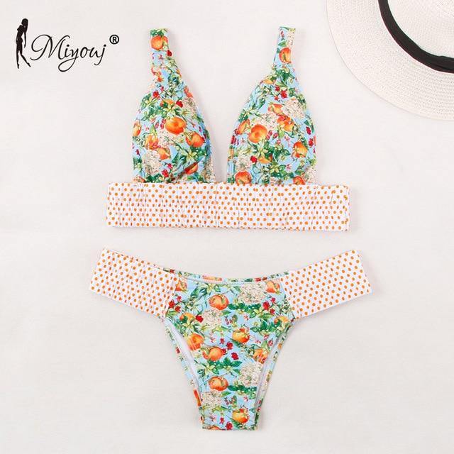 Deep V neck floral print bikini swimsuit with bow detail and lace-up design by The Clothing Company Sydney.