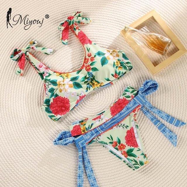 Deep V neck floral print bikini swimsuit with bow detail and lace-up design, from The Clothing Company Sydney.