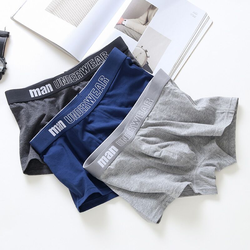 Four pairs of men's breathable cotton boxer briefs in solid colors, flexible and comfortable underpants by The Clothing Company Sydney.
