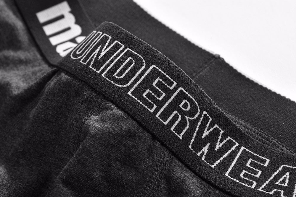 Four men's cotton boxer briefs from The Clothing Company Sydney, breathable solid shorts with flexible fit and classic design.