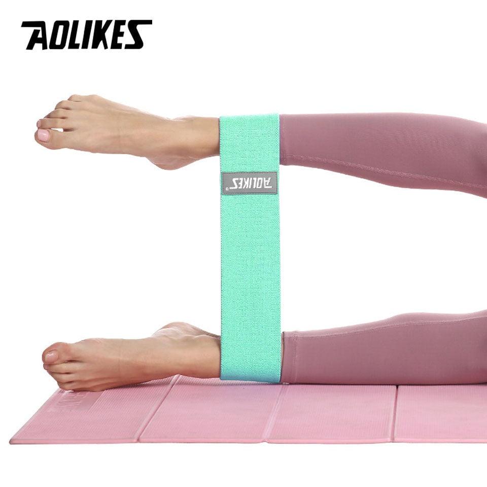 Wide fitness yoga resistance band from The Clothing Company Sydney, used for leg exercises, squats, and anti-slip training.