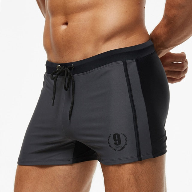 Men's breathable swim trunks by The Clothing Company Sydney, featuring quick-dry fabric and a comfortable fit for beach and swimwear.