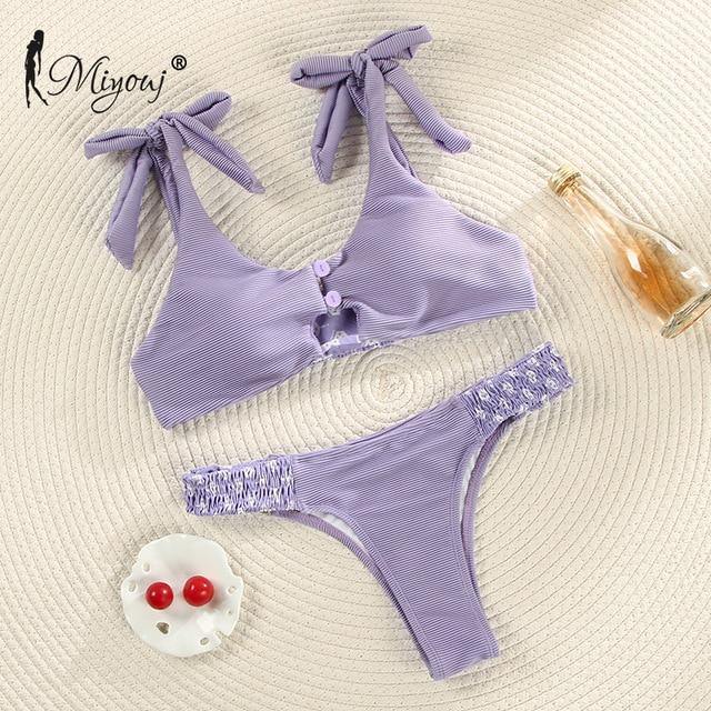 Deep V neck floral print bikini swimsuit with bow detail and lace-up design, by The Clothing Company Sydney.