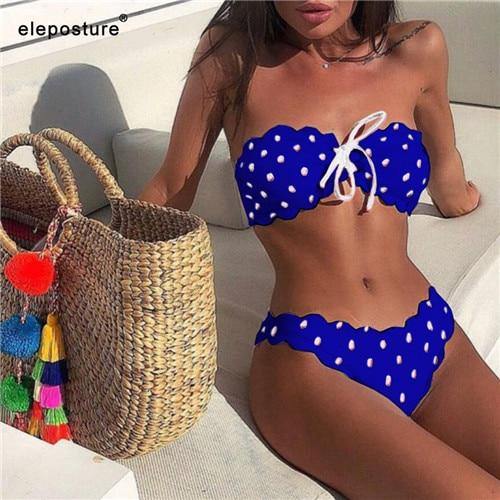Polka dot two-piece swimsuit by The Clothing Company Sydney with floral side accents, push-up style for beachwear and swimming.
